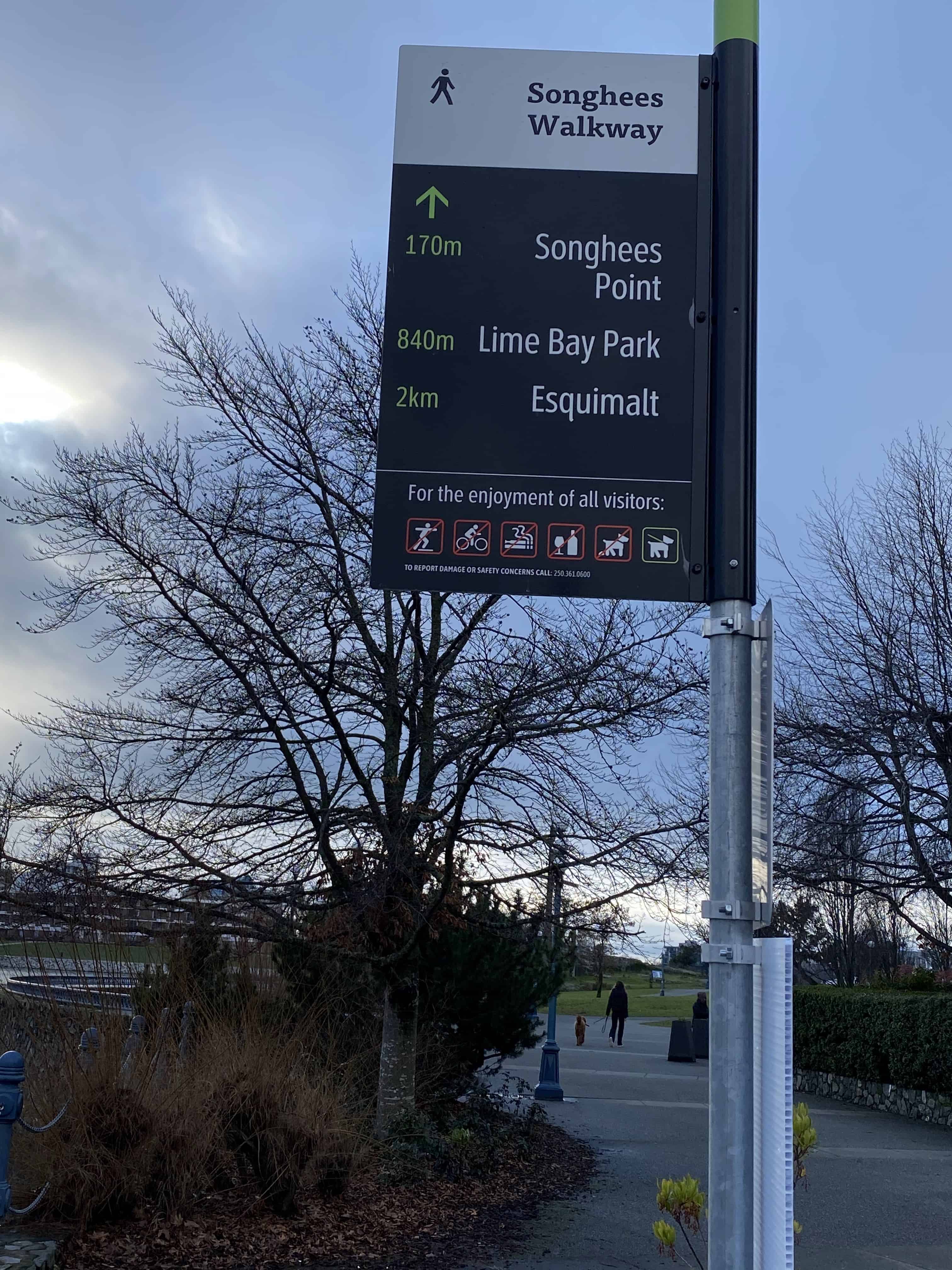 Songhees Walkway sign with distances along the walkway.