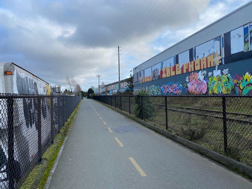 There is changing artwork on some of the building alongside the trail