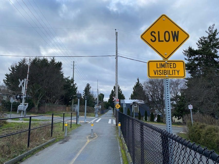 Coming up on an intersection with traffic, controlled rail crossing