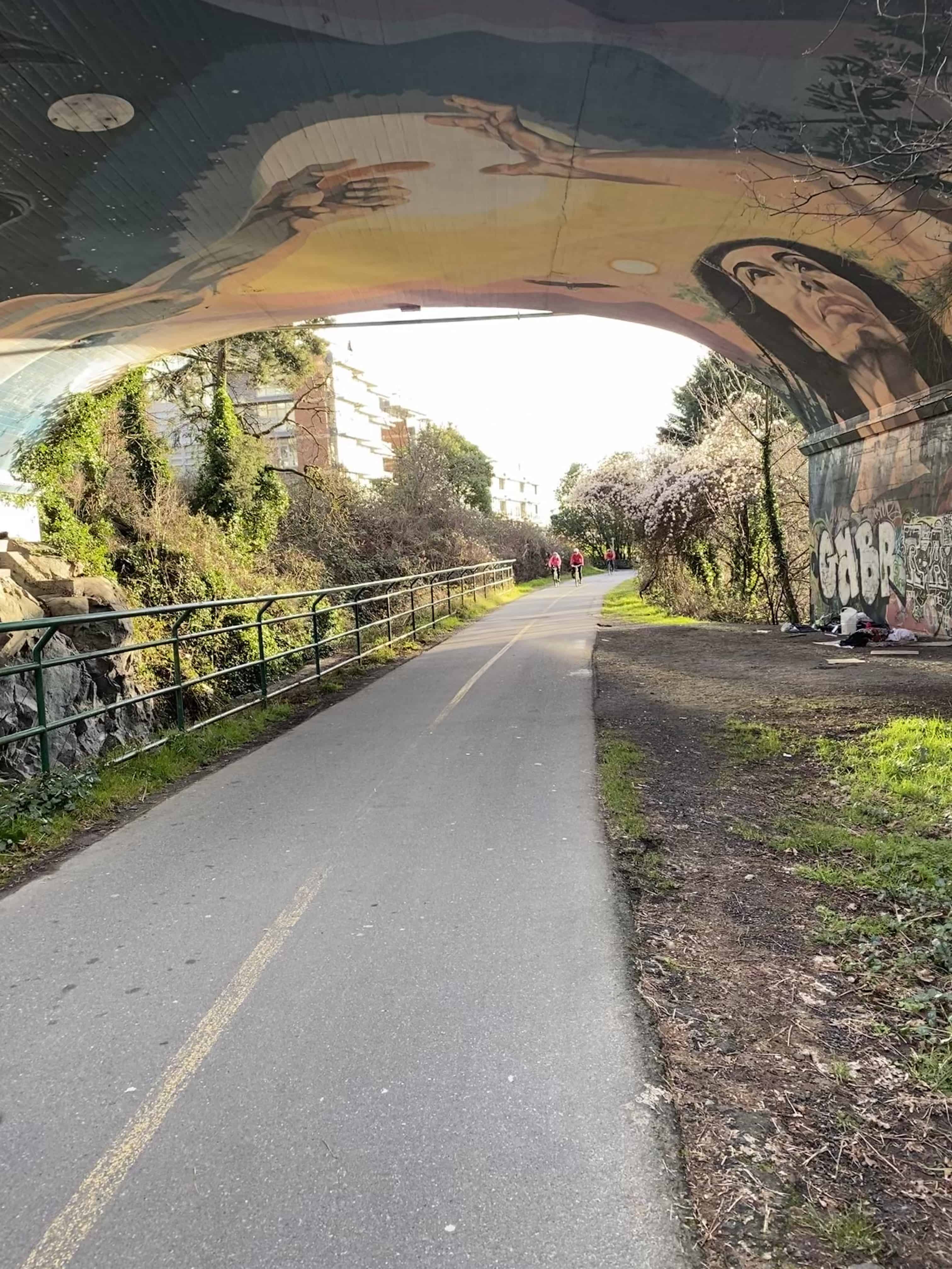 Artwork under bridge was much more extensive before it was touched with graffiti.  What remains is quite beautiful.