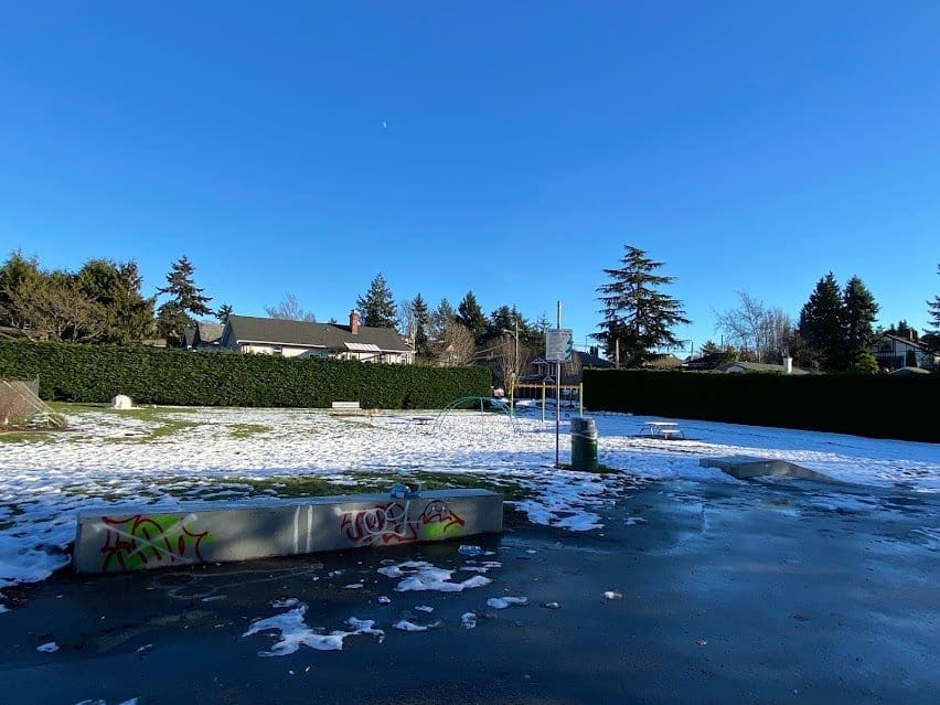 Esquimalt BC Parks Anderson Park, skateboard area and small playground in distance.  