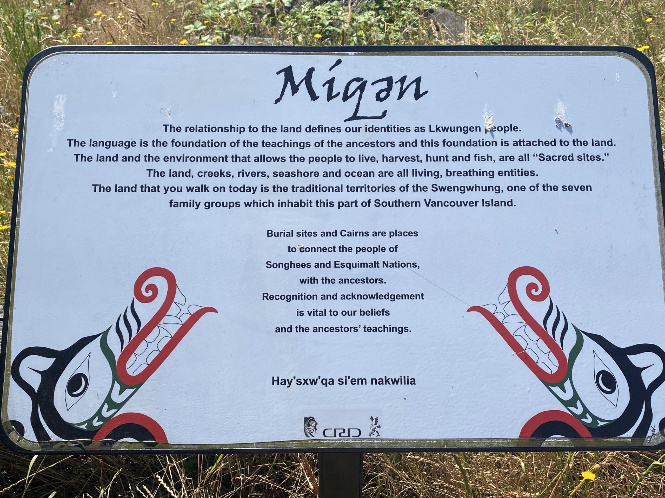 Sign with description and history and meaning of this area, a sacred site. Míqәn is the Lekwungen name for Beacon Hill.