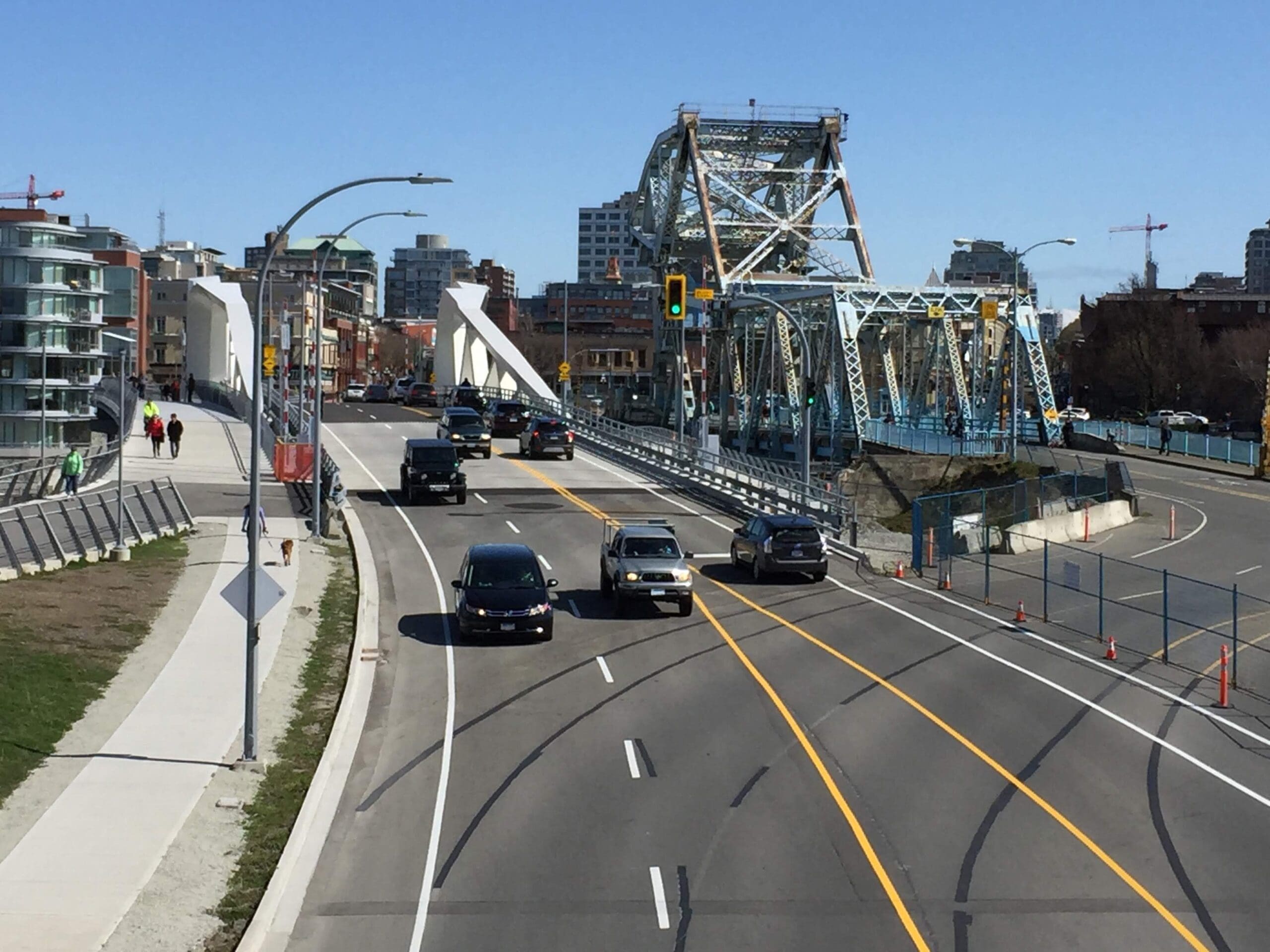 A unique perspective showing both the new modern bridge and the older "Blue" bridge on Johnson Street, both being lift bridges.
