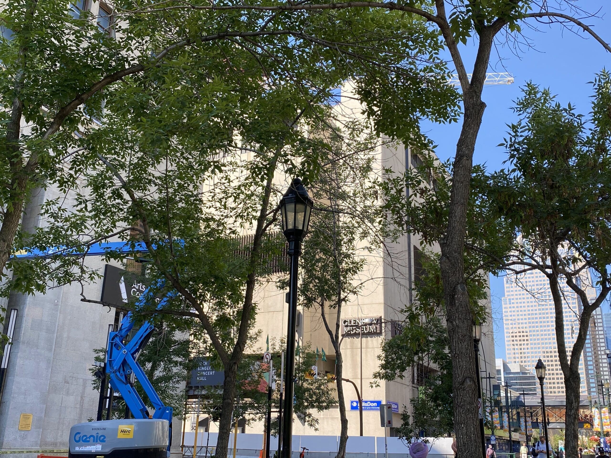 You can just see the Glenbow Museum sign through the green tree branches, currently under renovations.