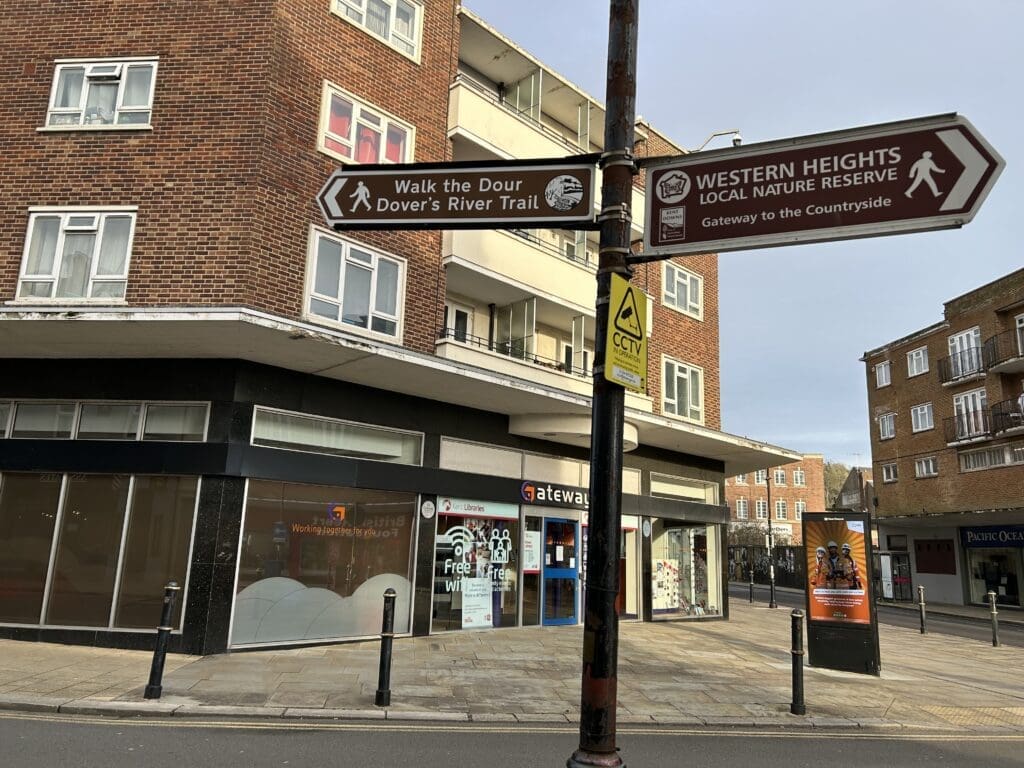 Signage post showing direction for "Walk the Dour" and "Western Heights" walks.