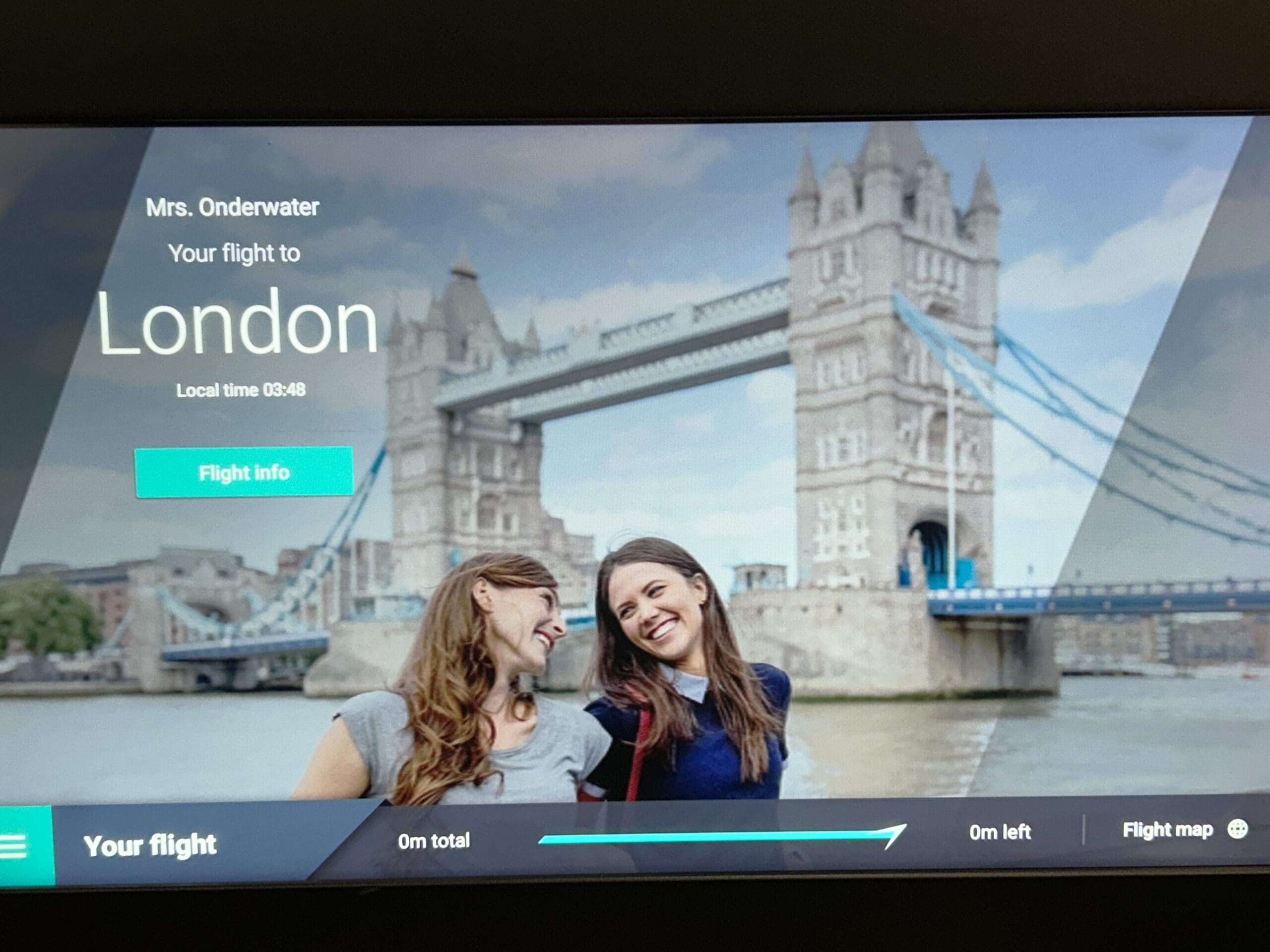 Panel in Flight (on plane), stating, "Mrs. Onderwater, your flight to London"